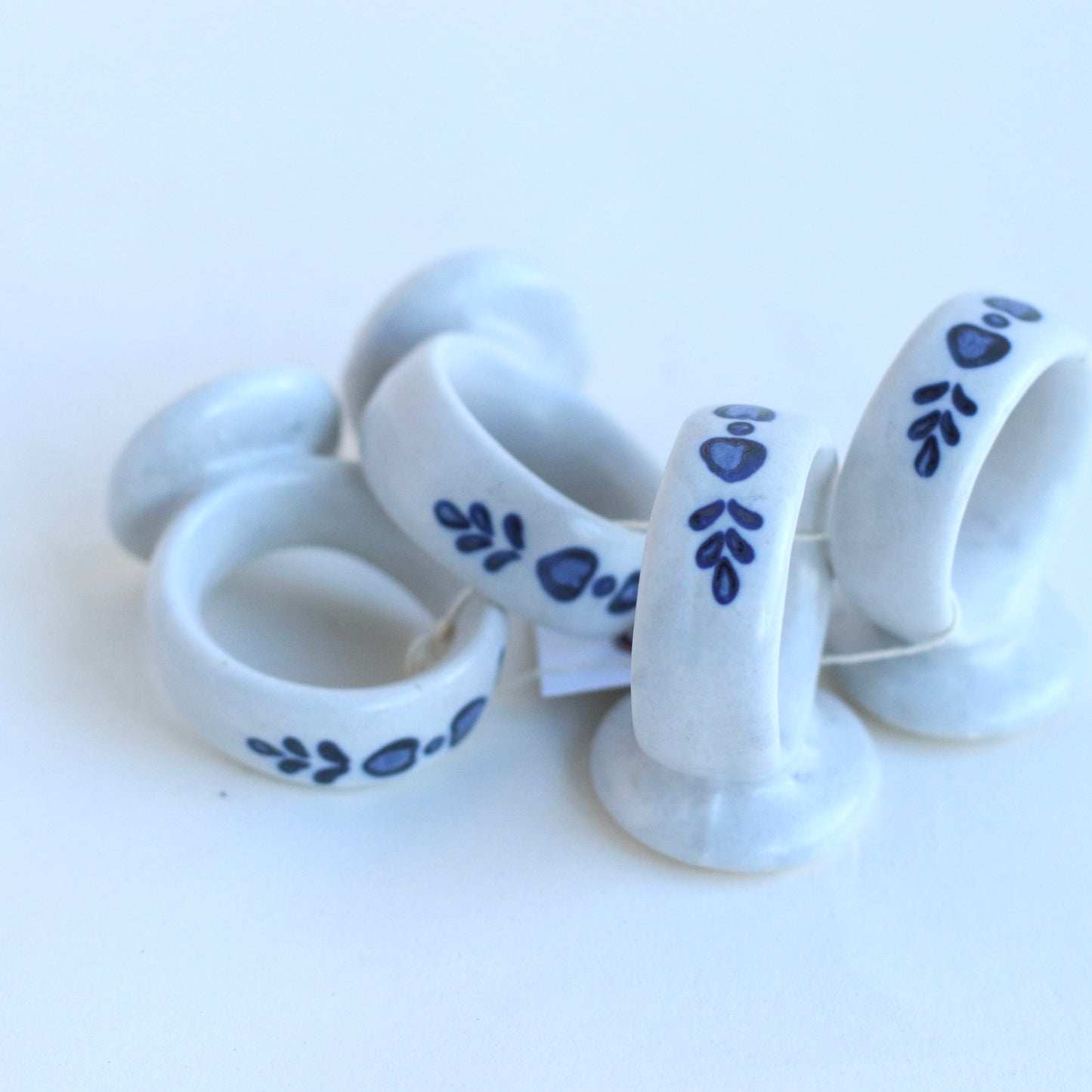 White Ceramic Napkin Rings with Blue Country Motif, set of 4