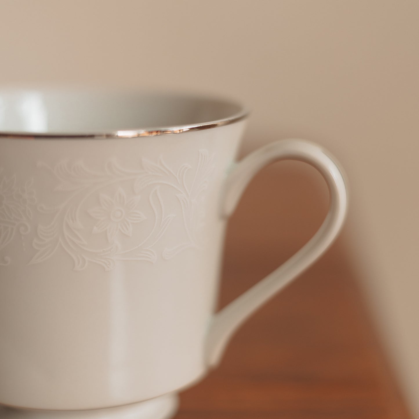 Crown Victoria Fine China Teacup with White Floral Accents and Silver Edge
