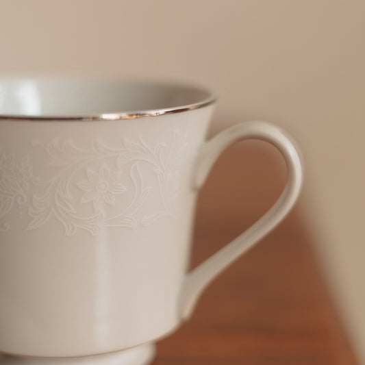 Crown Victoria Fine China Teacup with White Floral Accents and Silver Edge