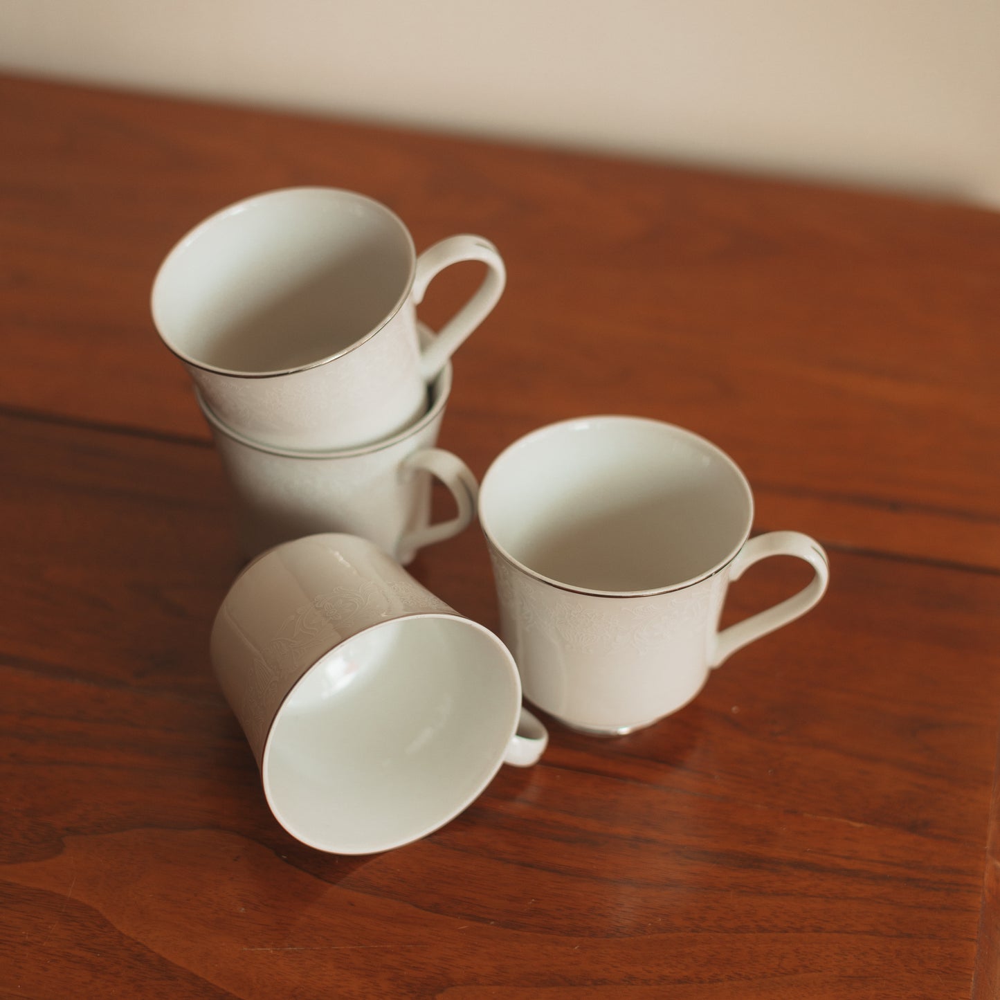 Crown Victoria Fine China Teacup with White Floral Accents and Silver Edge