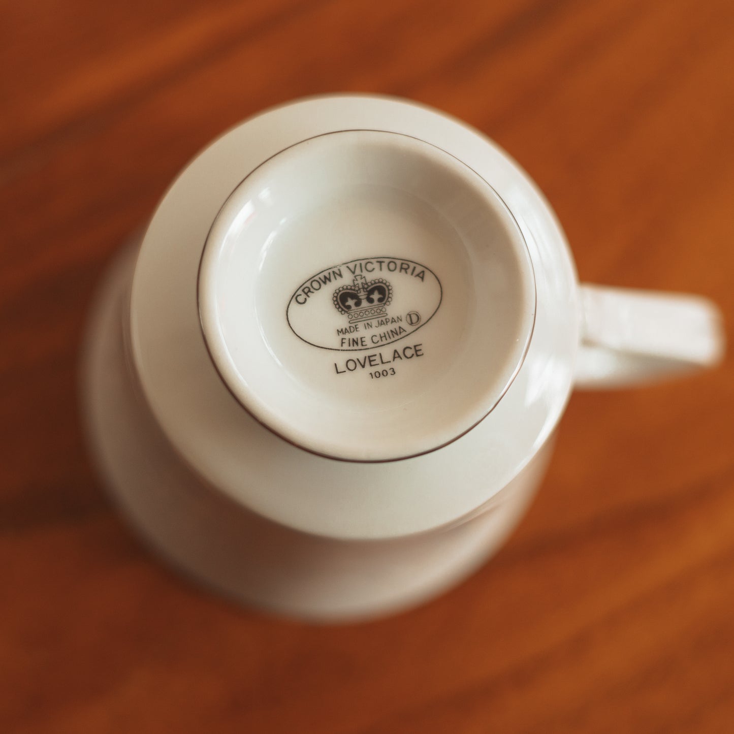 Crown Victoria Fine China Teacup with White Floral Accents and Silver Edge