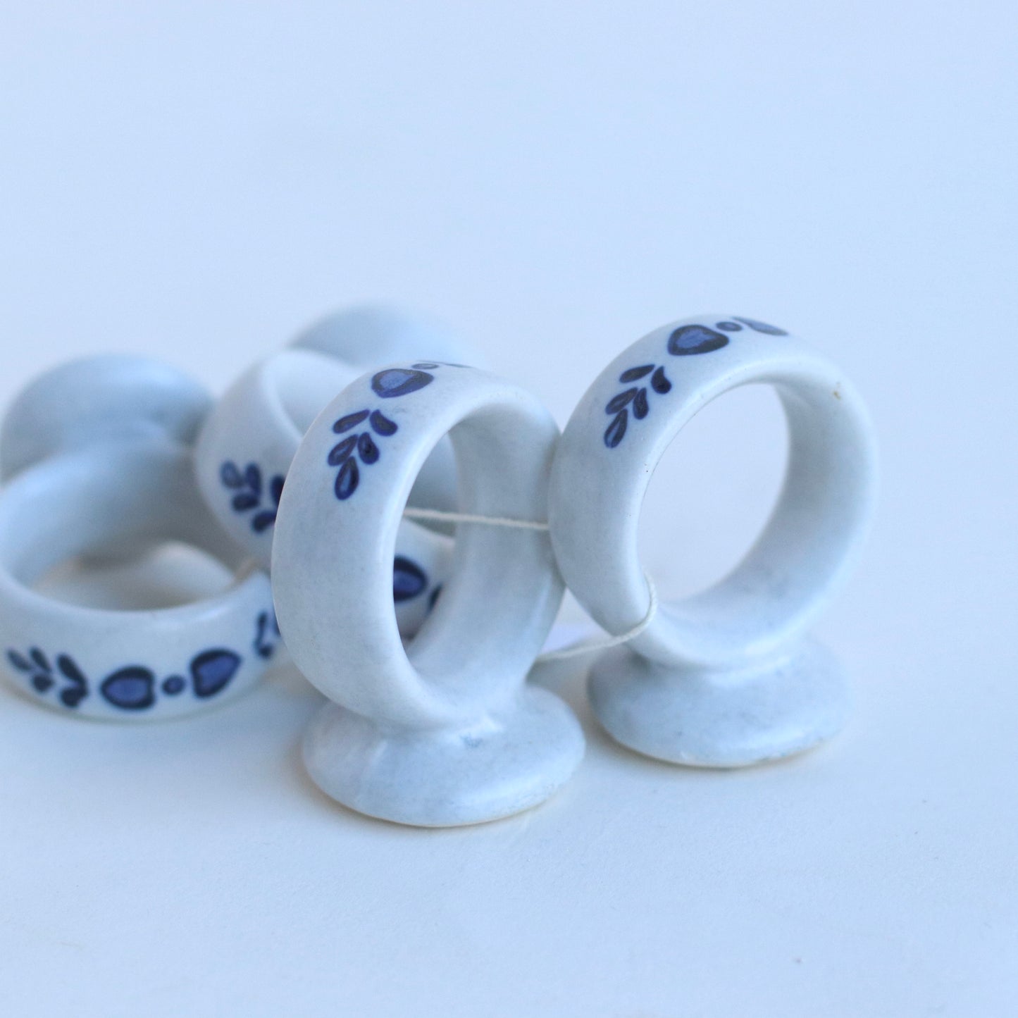 White Ceramic Napkin Rings with Blue Country Motif, set of 4
