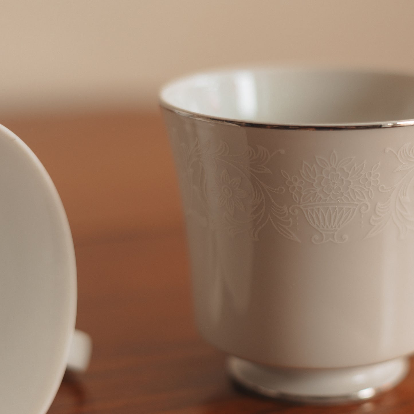 Crown Victoria Fine China Teacup with White Floral Accents and Silver Edge