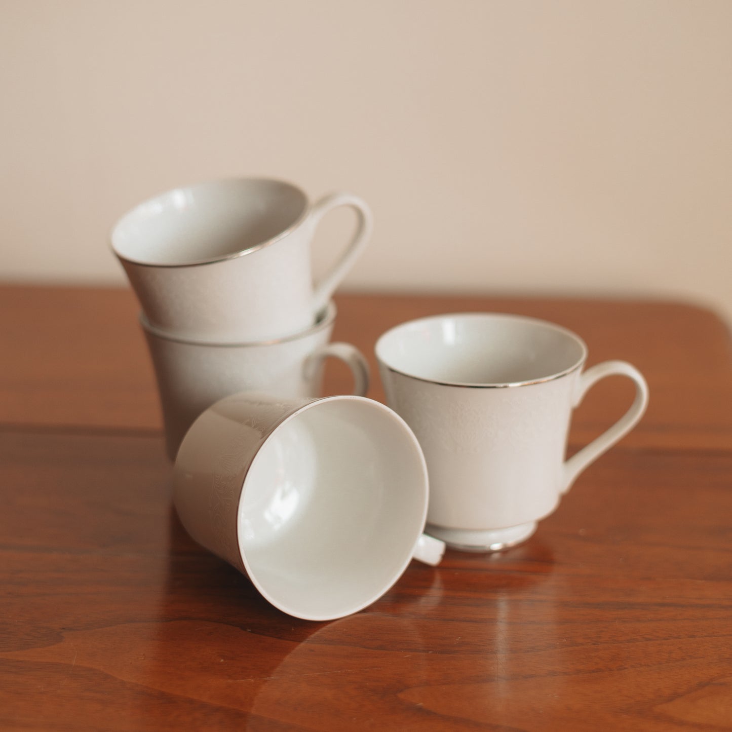 Crown Victoria Fine China Teacup with White Floral Accents and Silver Edge