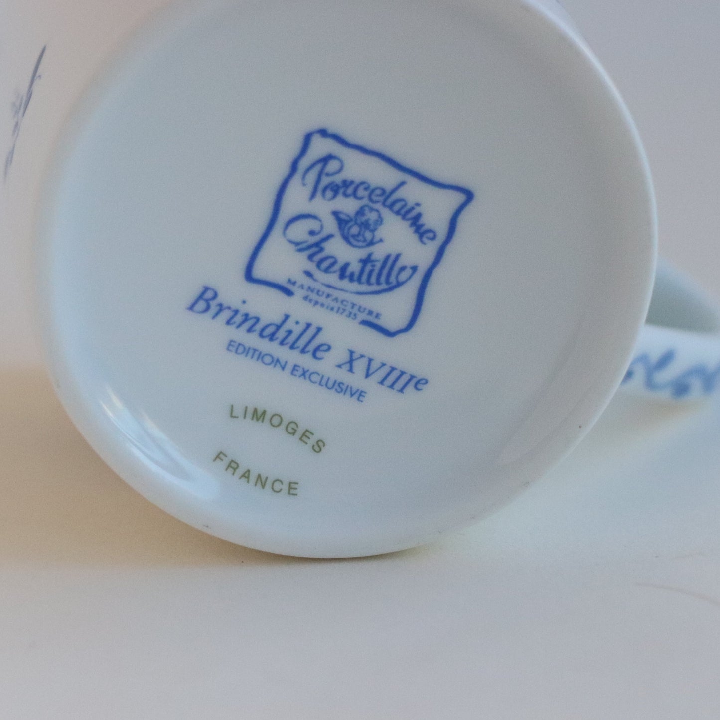 White Porcelain Mug with Blue Floral Decoration